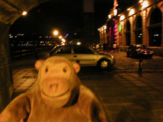 Mr Monkey looking at the Sea nightclub from under the Swing bridge