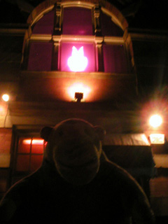 Mr Monkey looking at a vampire rabbit above the door of El Torero