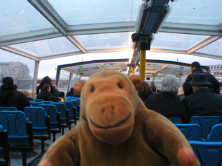 Mr Monkey aboard a boat sailing upriver