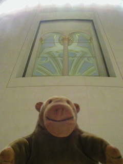 Mr Monkey looking at the ceiling of the Reading Room