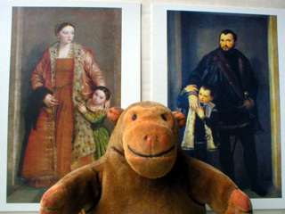 Mr Monkey in front of postcards of Iseppo and Livia da Porta