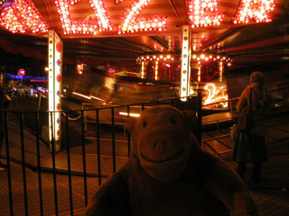 Mr Monkey looking at the waltzers in Leicester Square