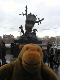 Mr Monkey looking at the sculpture outside the Dali Universe