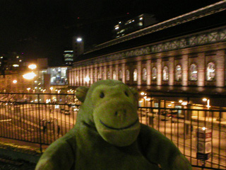 Mr Monkey looking at Piccadilly station from platform 13
