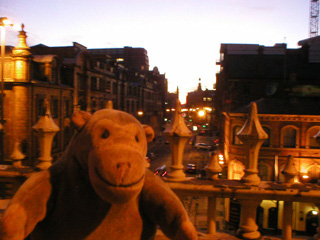 Mr Monkey looking down on Whitworth Street from the top of Station Approach