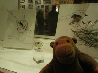 Mr Monkey looking at 3D wire birds by Cathy Miles