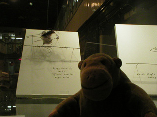 Mr Monkey looking at 3D wire birds by Cathy Miles