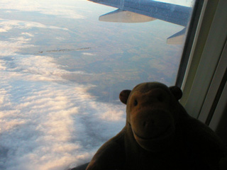 Mr Monkey looking down on some clouds