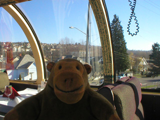 Mr Monkey looking across the railroad car in Renton