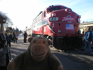 Mr Monkey watching people walk around the locomotive back at Renton