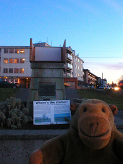 Mr Monkey looking at the plinth where a small Statue of Liberty replica should be