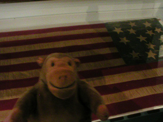 Mr Monkey examining a flag sewn during the battle