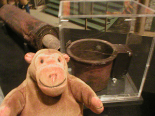 Mr Monkey looking at the Great Seattle Fire glue pot