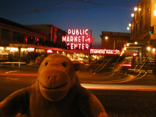 Mr Monkey outside the Pike Street Market at dusk