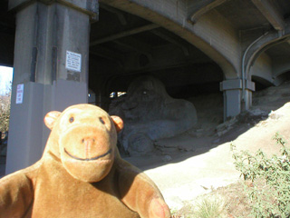 Mr Monkey looking at the Fremont Troll from the side
