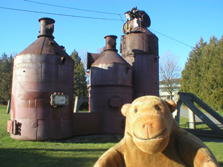 Mr Monkey looking at disused gasmaking equipment