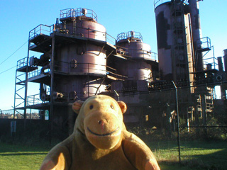 Mr Monkey looking at the disused cracking towers in Gasworks Park