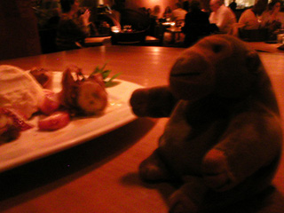 Mr Monkey tucking into banana spring rolls in P.F. Chang's