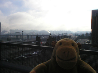 Mr Monkey looking towards the Tacoma Dome from the museum archway