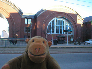 Mr Monkey looking across Pacific Avenue at the Washington State History museum