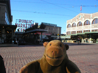 Mr Monkey walkiing towards the Pike Place Market