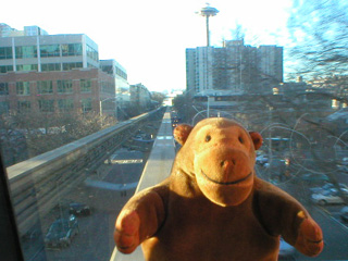 Mr Monkey on the monorail going down 5th Avenue