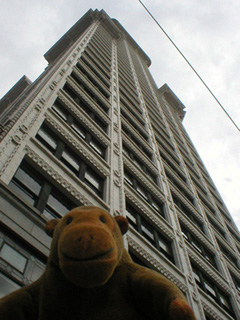 Mr Monkey looking up at Smith Tower