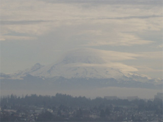 Mount Rainier surrounded by clouds
