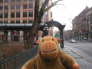 Mr Monkey looking at the Pioneer Place pergola