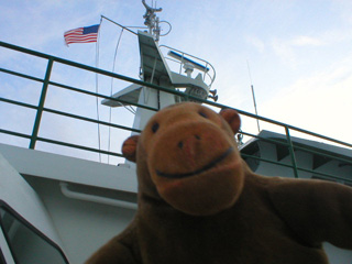 Mr Monkey looking up at the bridge of the ferry