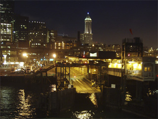 The Seattle ferry terminal lit up at night