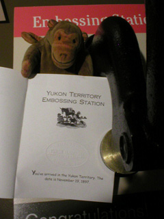 Mr Monkey having his passport embossed at the Yukon