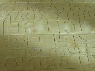 Some of the raised and reversed letters on Ann Hamilton's maple floor