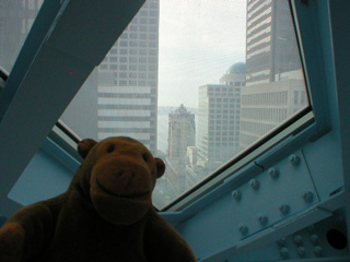 Mr Monkey looking at Elliot Bay from the Level 10 of the Central Library
