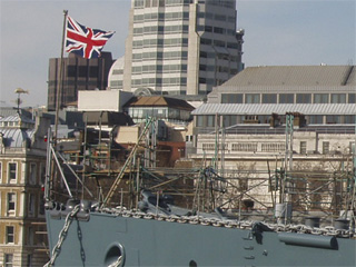 The Union Jack flying at the bow of HMS Belfast