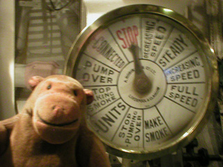 Mr Monkey looking at the telegraph in the forward boiler room