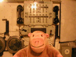 Mr Monkey examining the Engine Officer of the Watch control platform