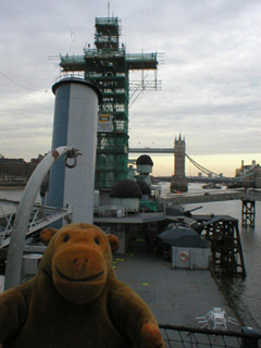 Mr Monkey looking across the boat deck to the 4-inch guns from the bridge