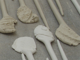 Unbaked clay pins