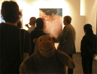 Mr Monkey at the back of the crowd during a gallery tour