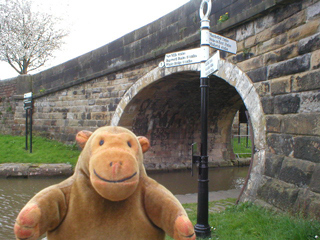 Mr Monkey at the junction of the Peak Forest Canal and the Macclesfield Canal