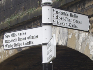 The signpost at the junction of the Peak Forest Canal and the Macclesfield Canal