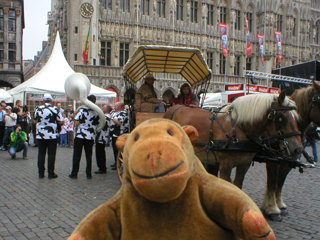 Mr Monkey watching the Walloon Cheese band playing in the Grand Place