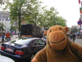 Mr Monkey watching a police van drive away