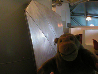 Mr Monkey examining a chunk of Atomium skin