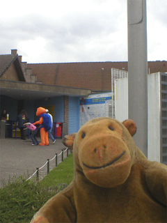 Mr Monkey watching the Mini-Europe turtle greeting people