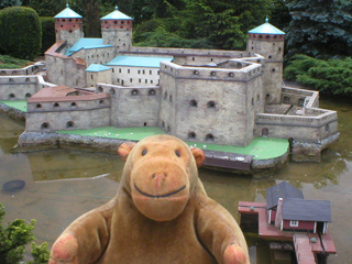 Mr Monkey looking at Olavinlinna Castle