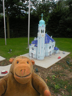 Mr Monkey looking at Bratislava's Blue Church