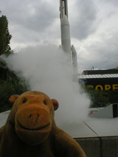 Mr Monkey watching Ariane smoke a lot