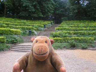 Mr Monkey looking up at the Théâtre de Verdure